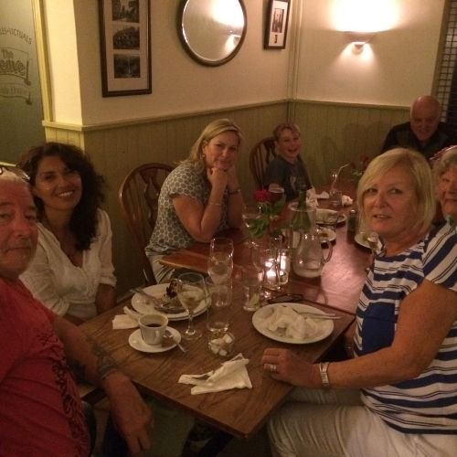 Large family gathering having dinner at the thatched village pub in Lustleigh on Dartmoor