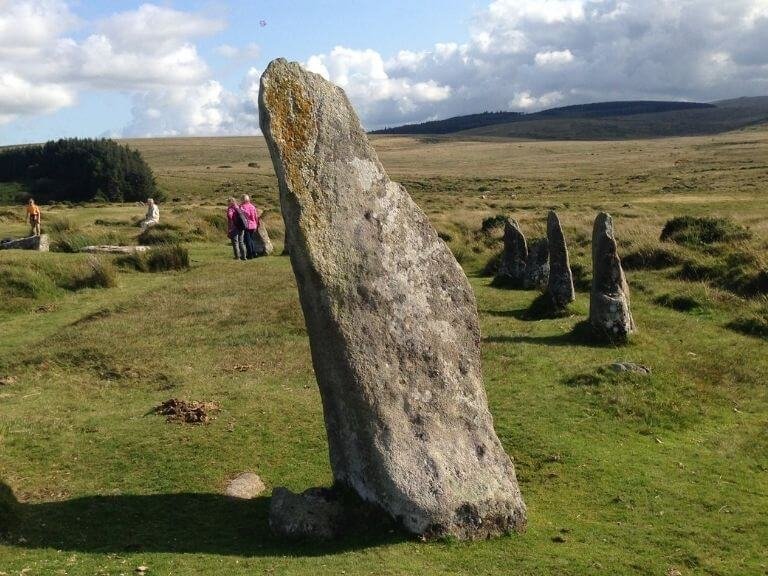 Guests from our Devon holiday home walking amongst an ancient stone circle on Dartmoor