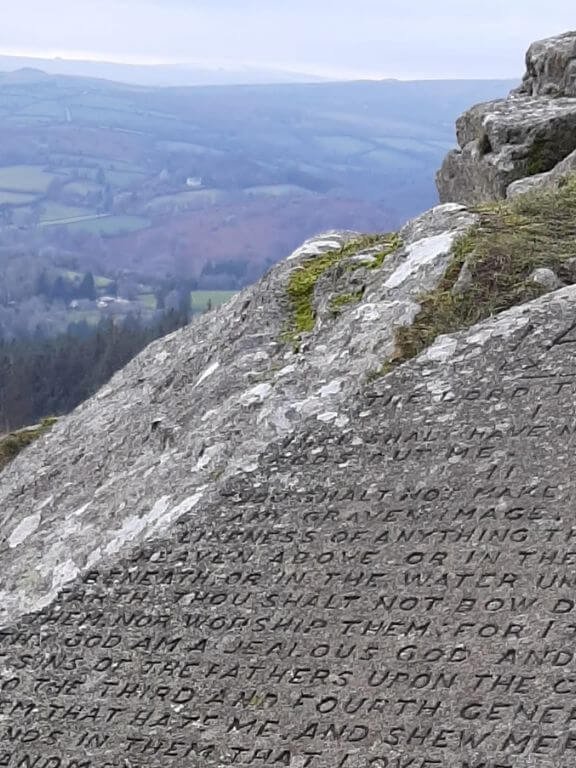 10 Commandments engraved on granite slab with view of dartmoor behind