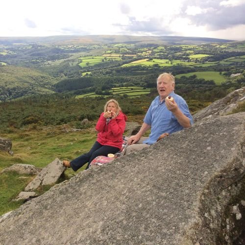 Guests enjoying a picnic Devon Cream Tea on Dartmoor's 10 Commandment Stones