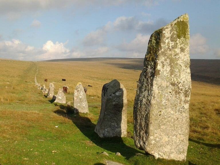 A row of large upright granite stones fading into the distance