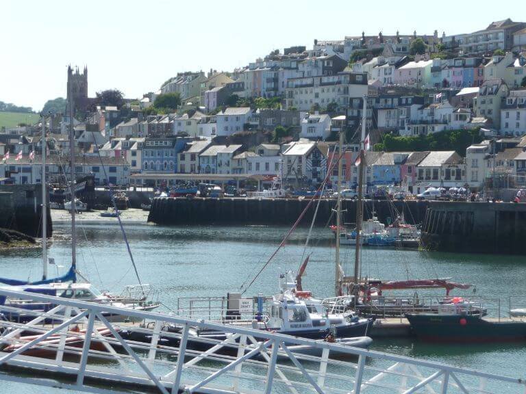 View of Brixham from the marina showing the church amongst the colourful cottages